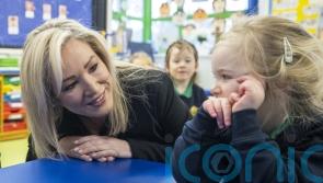 First Minister put to work during trip to former primary school