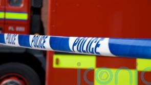 Dozens of firefighters tackle shop blaze