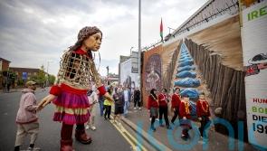 Little Amal meets schoolchildren from both sides of Belfast peace wall