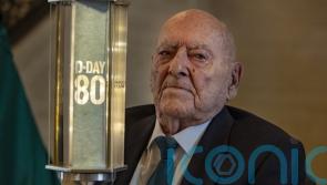 D-Day veteran passes commemorative torch to pupils to mark 80th anniversary