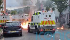 Violent clashes and businesses attacked amid anti-immigration protest in Belfast