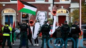 Four arrested after protests during Clinton visit to Queen&rsquo;s University