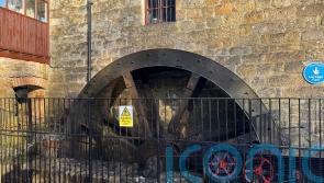 Water wheel starts turning again to power restaurant at historic mill