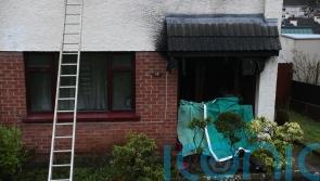 Police officers hailed after rescuing adults and children from burning house