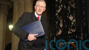No question of paying any paramilitary group to disband, says Hilary Benn