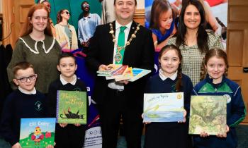 IN PICTURES: Irish language books to local Gaelscoileanna for World Book Day
