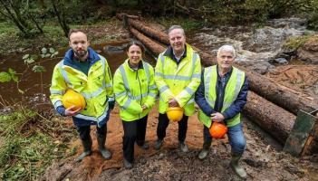  At the “leaky dams” flood mitigation pilot: Mike O’Gorman, DFI Rivers, Infrastructure Minister Liz Kimmins, Gary Quinn, Acting Director of Operations, DFI Rivers & Kenny Acheson DAERA Forest Service.