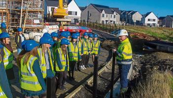 Derry students get behind-the-scenes look at new housing development