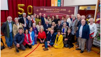 Teachers & pupils from the year St Brigid's opened, with first Principal Frank Dunne centre. PHOTO: PETER KANE.