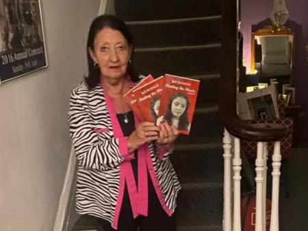 Ray McGinley with her newly published memoir, 'Finding the Music'.