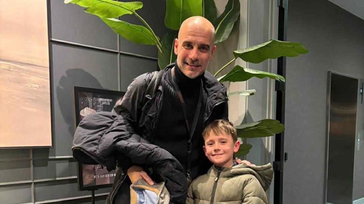 Football mad Manchester United fan bumps into City manager Pep Guardiola