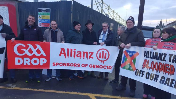 Derry and Tyrone greats at Saturday's Celtic Park 'Drop Allianz' protest.