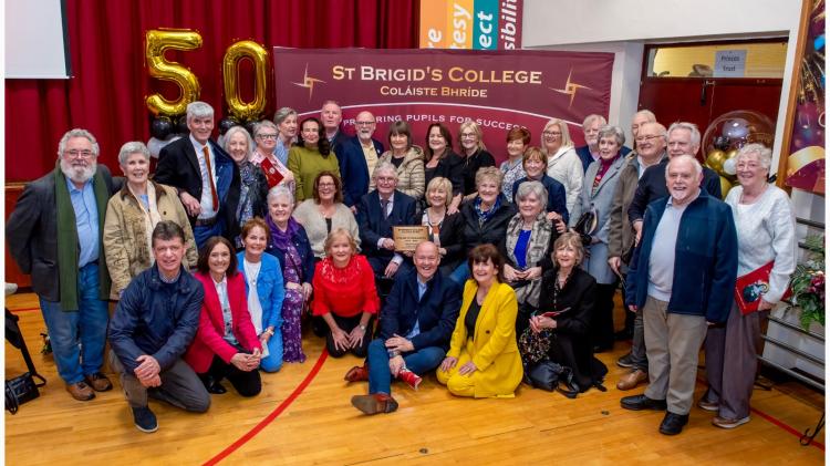 Teachers & pupils from the year St Brigid's opened, with first Principal Frank Dunne centre. PHOTO: PETER KANE.