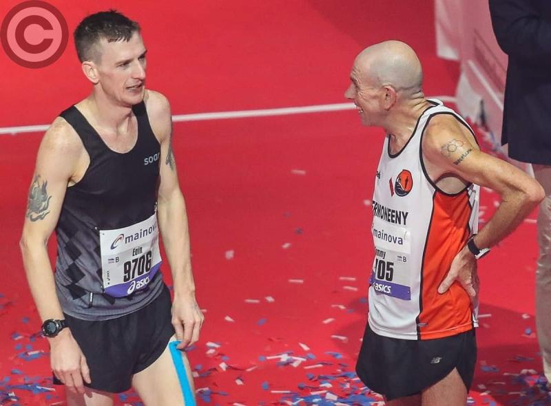 Eoin Hughes and father Tommy moments after completing the Frankfurt Marathon in Germany on Sunday. The pair smashed the world record for  fastest father and son duo.