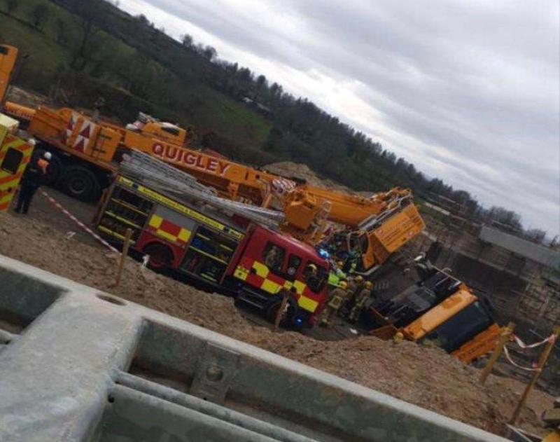Emergency crews respond after a crane being used on main Derry to Belfast road project topples over 