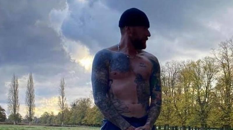 Sir Bradley Wiggins goes running in socks designed by local cyclist
