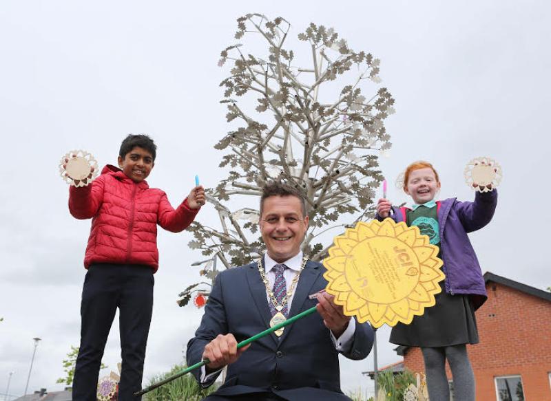 Derry young people's images of hope tied round Peace Tree