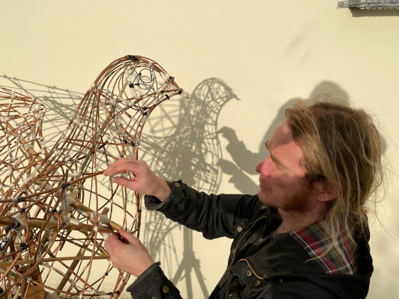 Donegal artist Ewan Berry working on the specially commissioned light installation that will be showcased at the Light of the Dove event.
