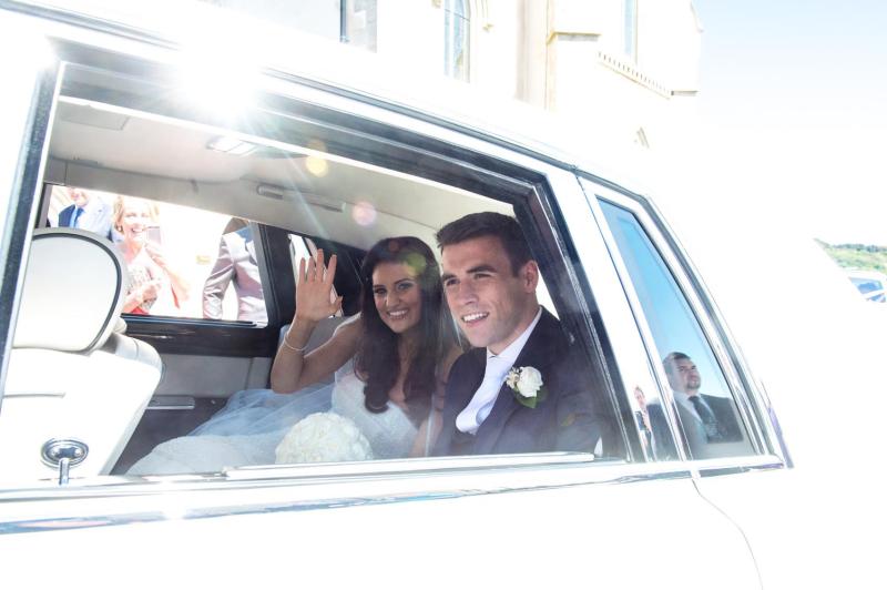 Seamie and Rachel depart the chapel for the wedding reception