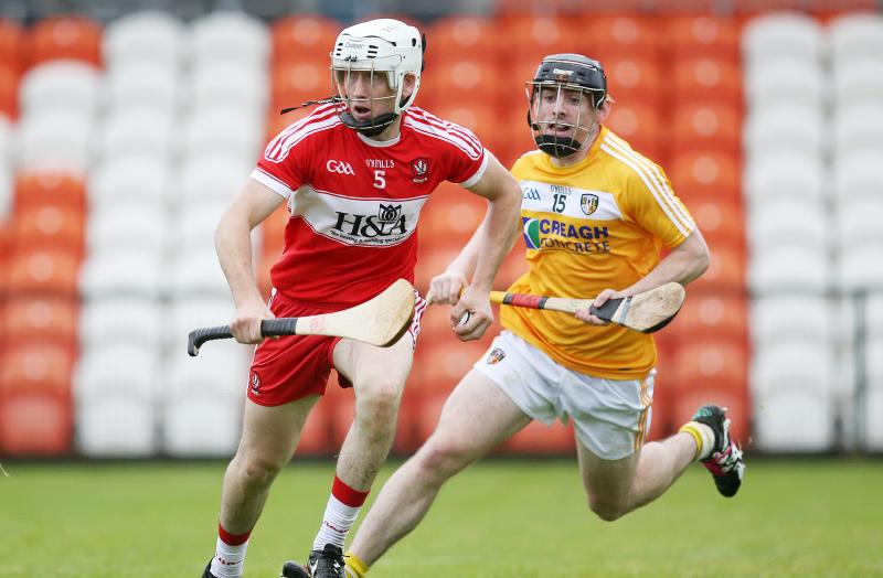 Derry's Sean McCullagh in action against Antrim's Ciaran Clarke