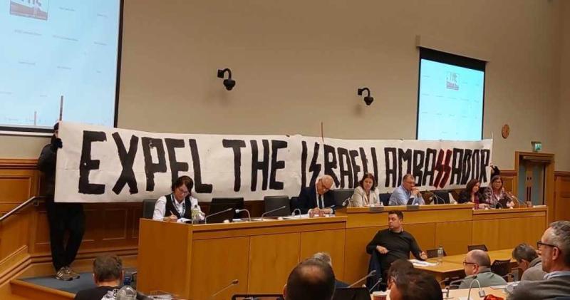 A banner held by protestors at Wednesday's Full Meeting of DCSDC