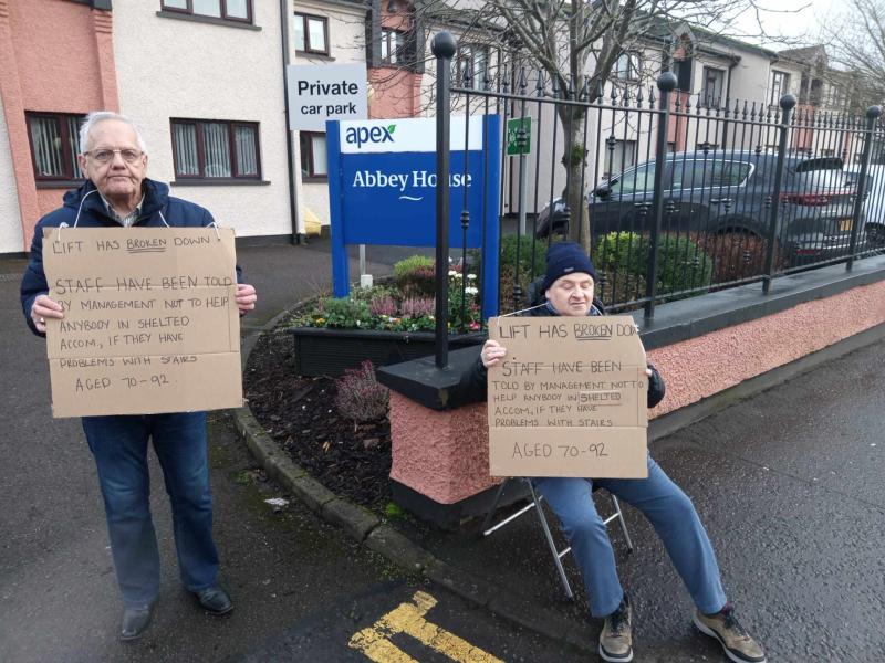 Abbey House residents John and Tony protesting at the lift in the building being broken for more than a month.