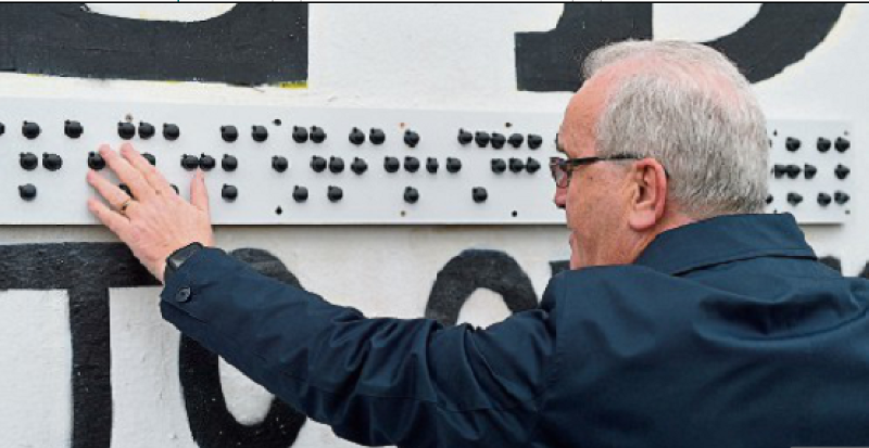 Richard Moore pictured at the unveiling of a braile sign at Free Derry Corner