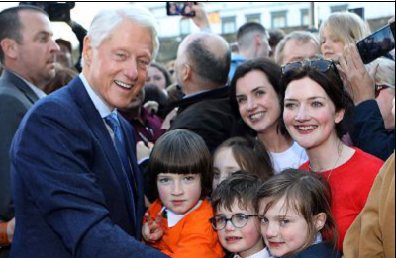 Former US President Bill Clinton with members of the Derry public outside the Guildhall.