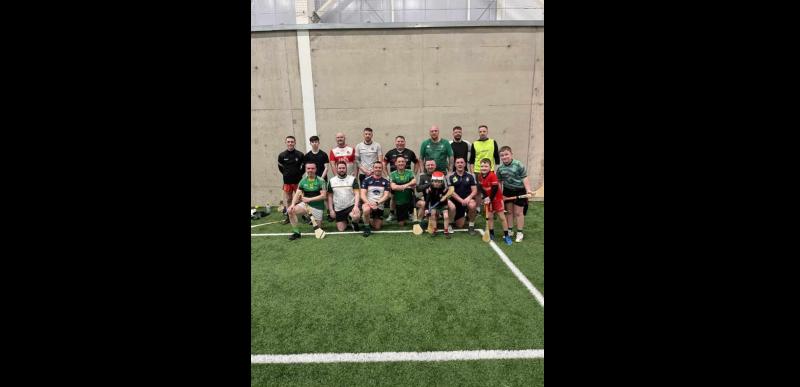 Ciarán McCarron centre with the social hurlers.