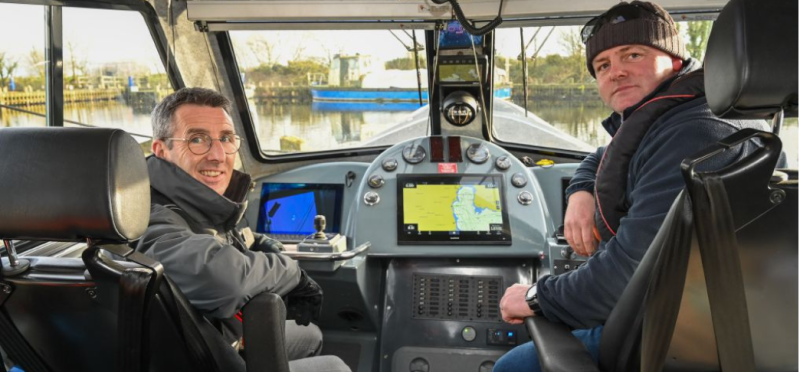 DAERA Minister Andrew Muir (left) takes a boat trip across Lough Neagh with Skipper and Fisheries Officer Eoin McFadden.