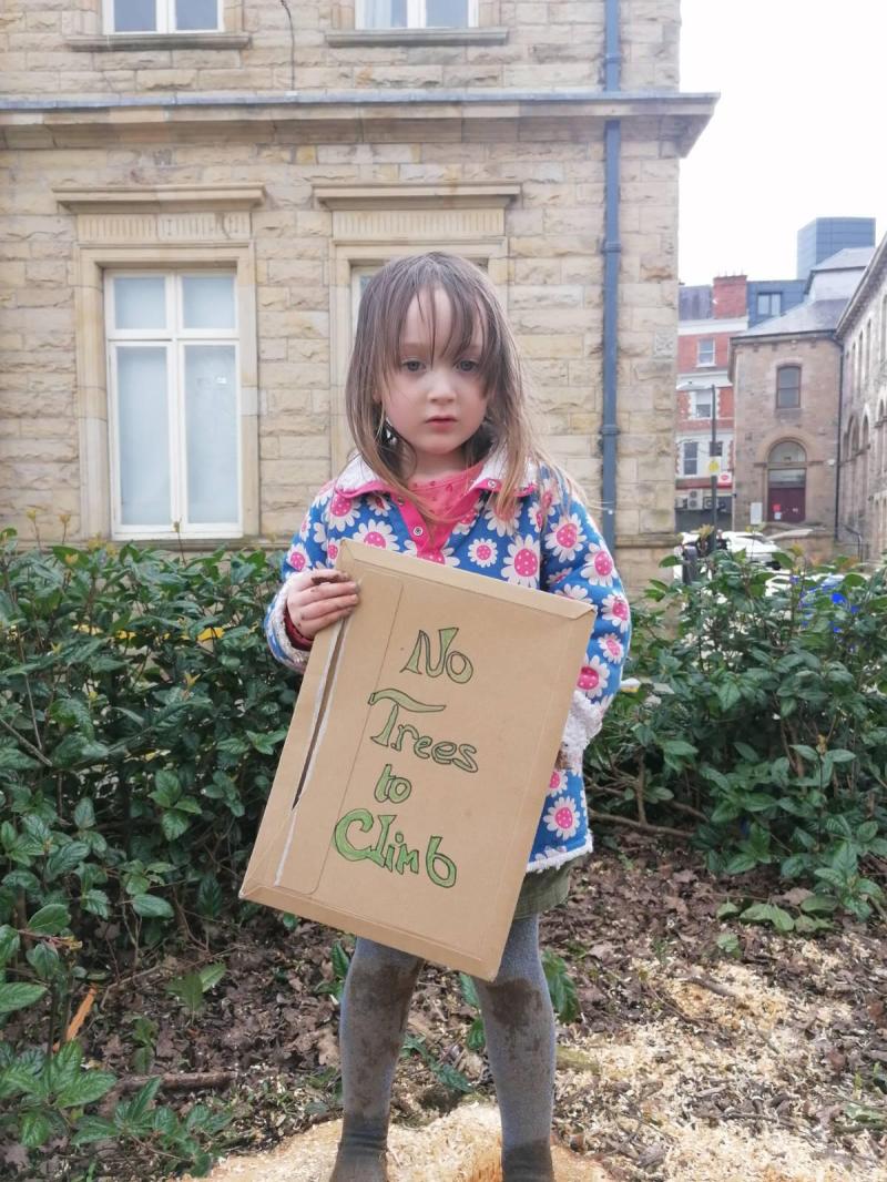 Young Alice O'Callaghan at Saturday's protest at Council plans to cut down trees in Derry's Harbour Square.