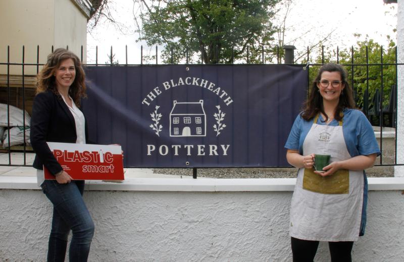 Babs Belshaw, potter, at Blackheath Pottery and Coffee shop promoting H2O On the Go free water bottle refills as part of their PlasticSmart awarded business practices, with Fiona Watters