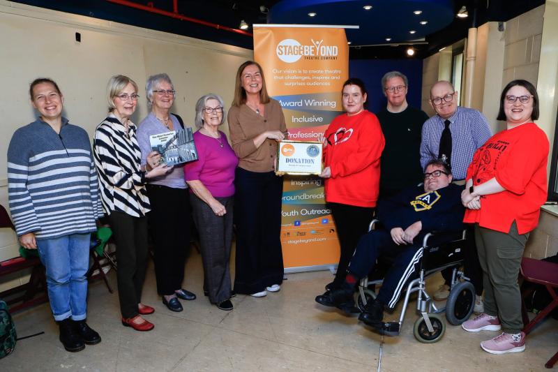 Yvonne Norris presenting donation to Bernie Shiels, chairperson, Stage Beyond. L-R: Becca Barnes, Mary Doherty, Sadie Harkin & Clare Moore, Susannah McKay, Frank Neils, Darren Bond & Kevin Harkin.