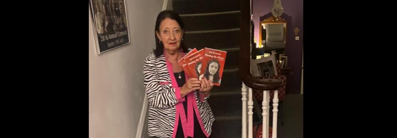 Ray McGinley with her newly published memoir, 'Finding the Music'.