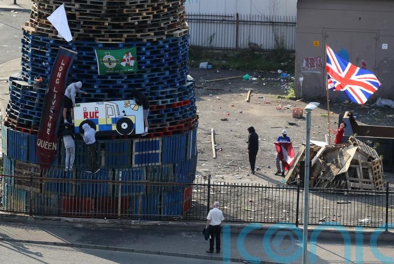 Placing of flags and images on nationalist bonfire condemned