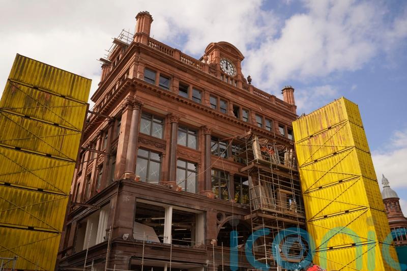 Facade of landmark city centre building begins to emerge