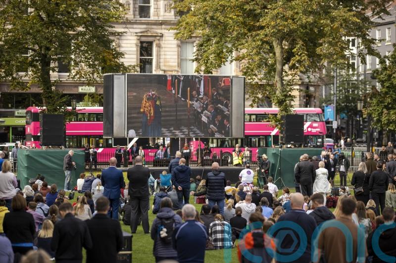 Crowds gather in silent tribute to Queen in Belfast to watch state funeral