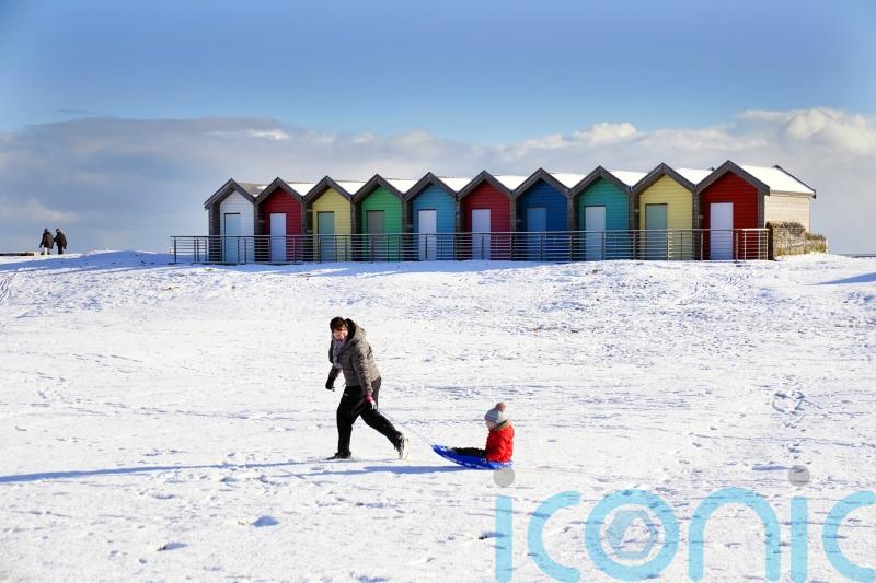 People wake up to snow as cold snap begins to sweep the UK