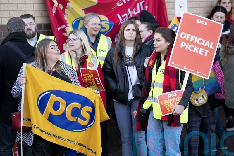 Passport workers begin five-week strike in row over pay and conditions