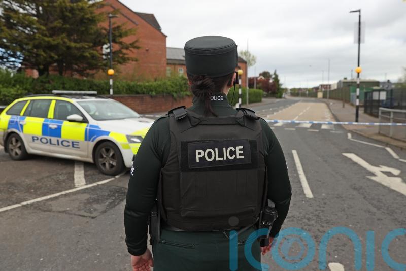 Man charged after crash close to Belfast police station