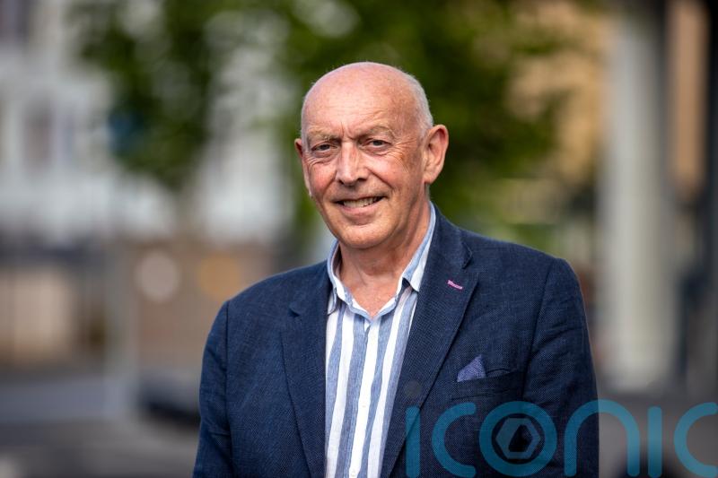 Man who helped bring about Queen and McGuinness handshake becomes a CBE