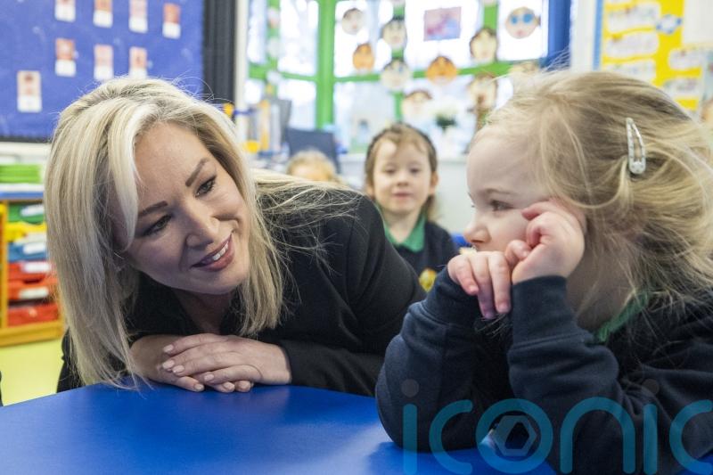 First Minister put to work during trip to former primary school