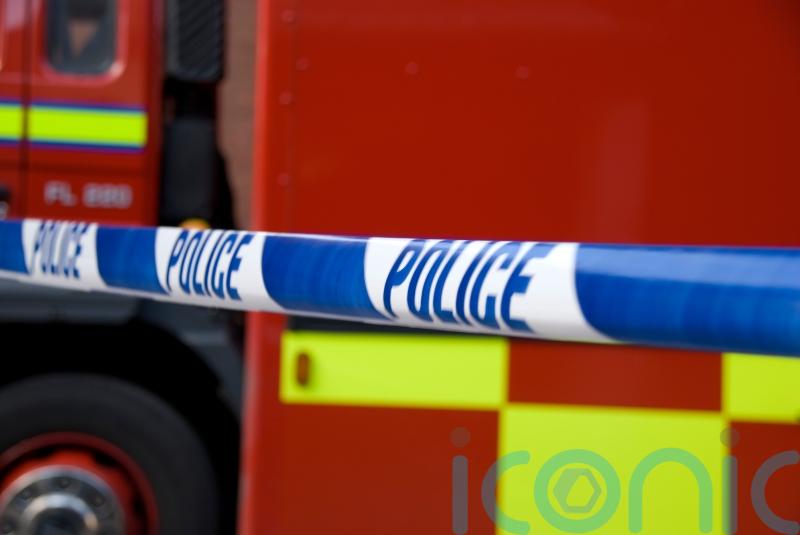 Dozens of firefighters tackle shop blaze