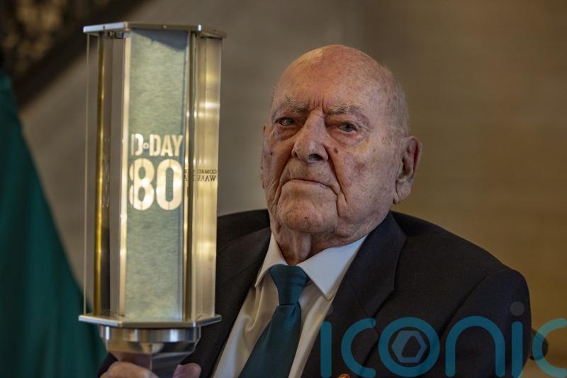 D-Day veteran passes commemorative torch to pupils to mark 80th anniversary