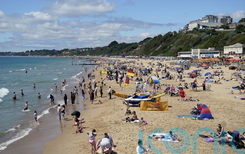 Heat health alerts issued as temperatures near 30C