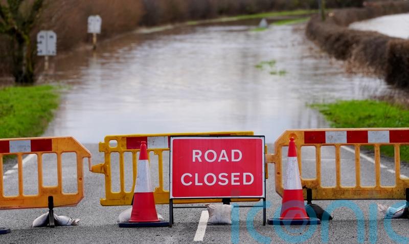 Severe flooding and snow disrupt travel as weather warnings remain