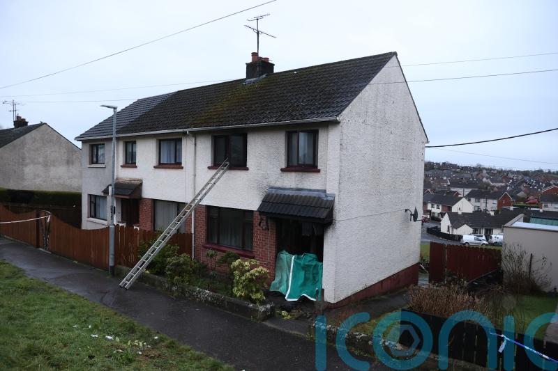Man arrested on suspicion of arson after four people rescued from burning house