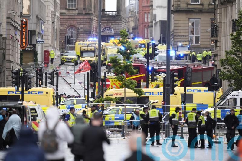 Man arrested after car ploughs into crowds of people at Liverpool victory parade