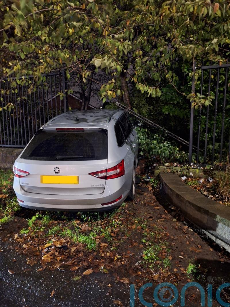 Officers injured after car rammed through fence