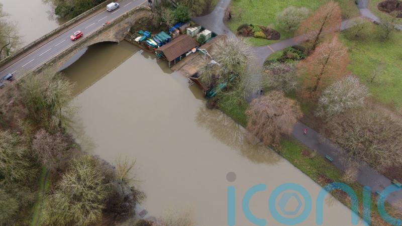 Ice warning after heavy rain and melting snow causes flood disruption